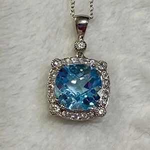 Blue Topaz gemstone with CZs accents set in .925 Sterling Silver 18” SS Chain